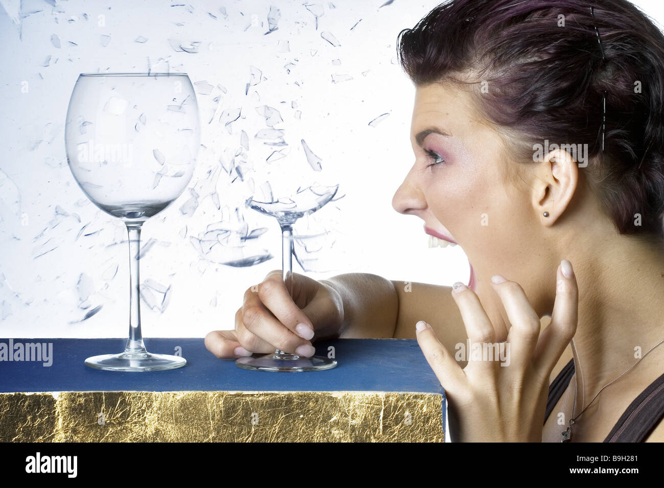 woman scream wine glasses glass shatters side-portrait people Sangerin  young facial expression hysteria voice sound chant sings Stock Photo - Alamy