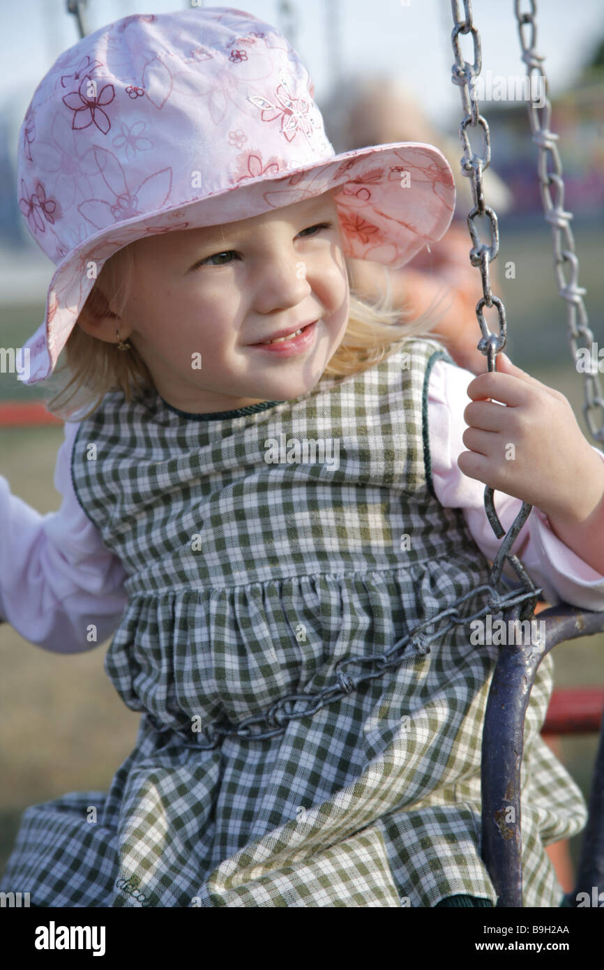 Little girl having fun on carousel Stock Photo