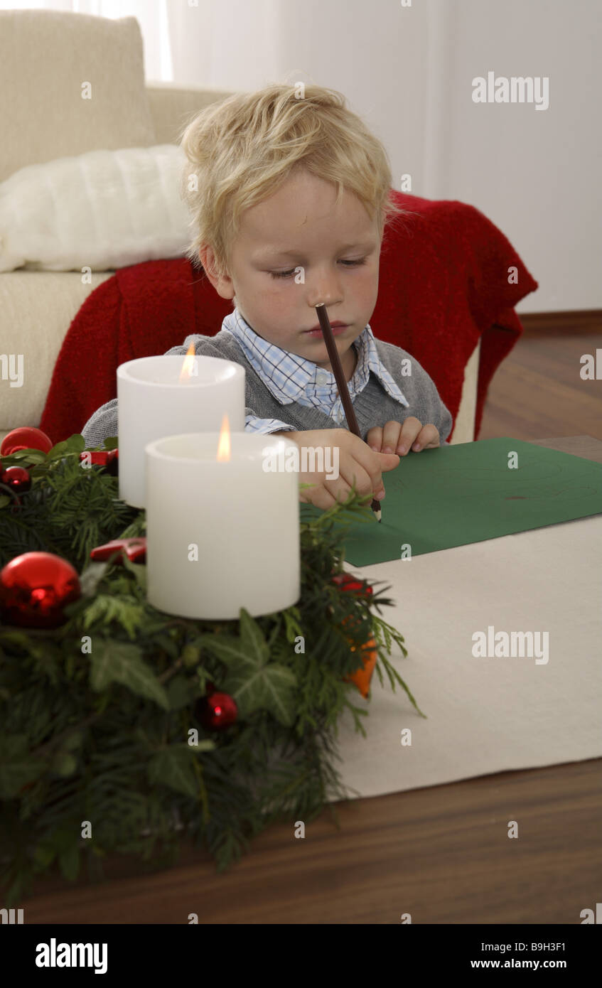 boy picture drawing advent-wreath candles portrait burning 4 years advent advent-wreath activity thoughtfulness picture blond Stock Photo