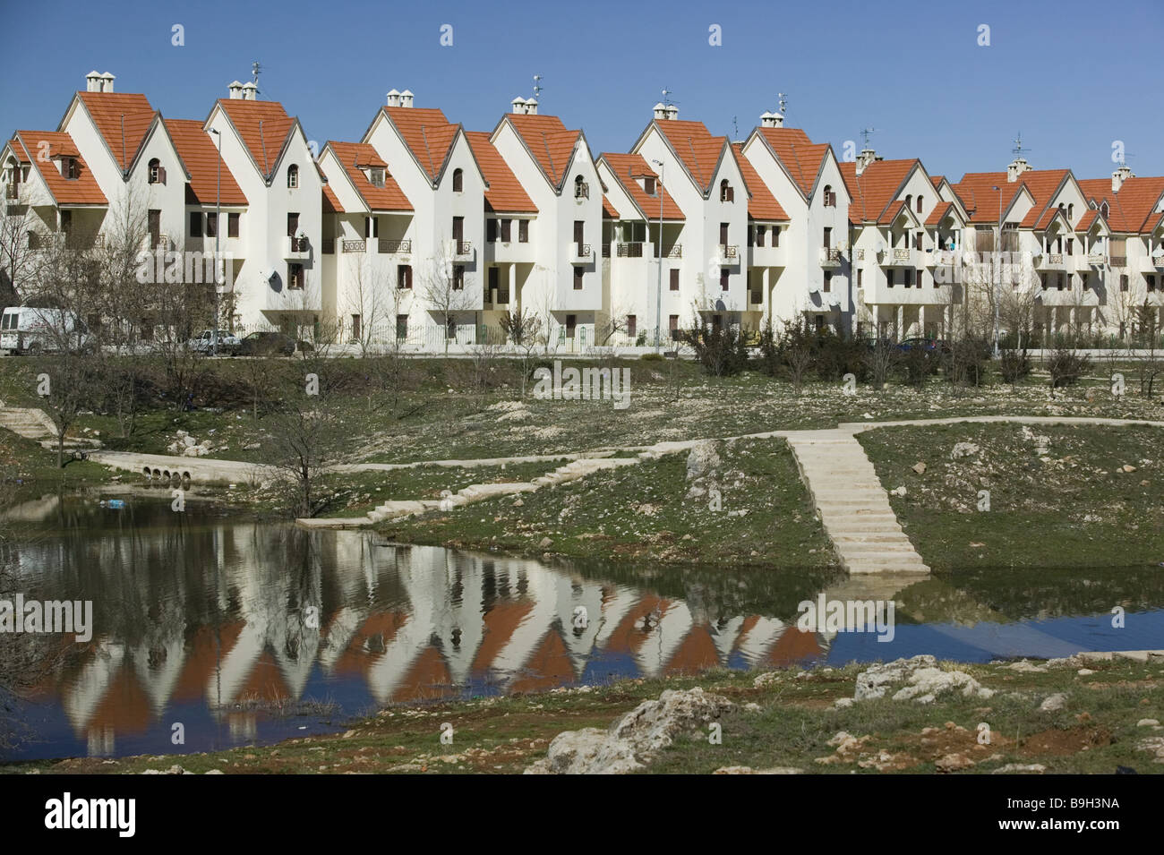 Morocco Ifrane settlement houses park pond Africa NorthAfrica city buildings residences
