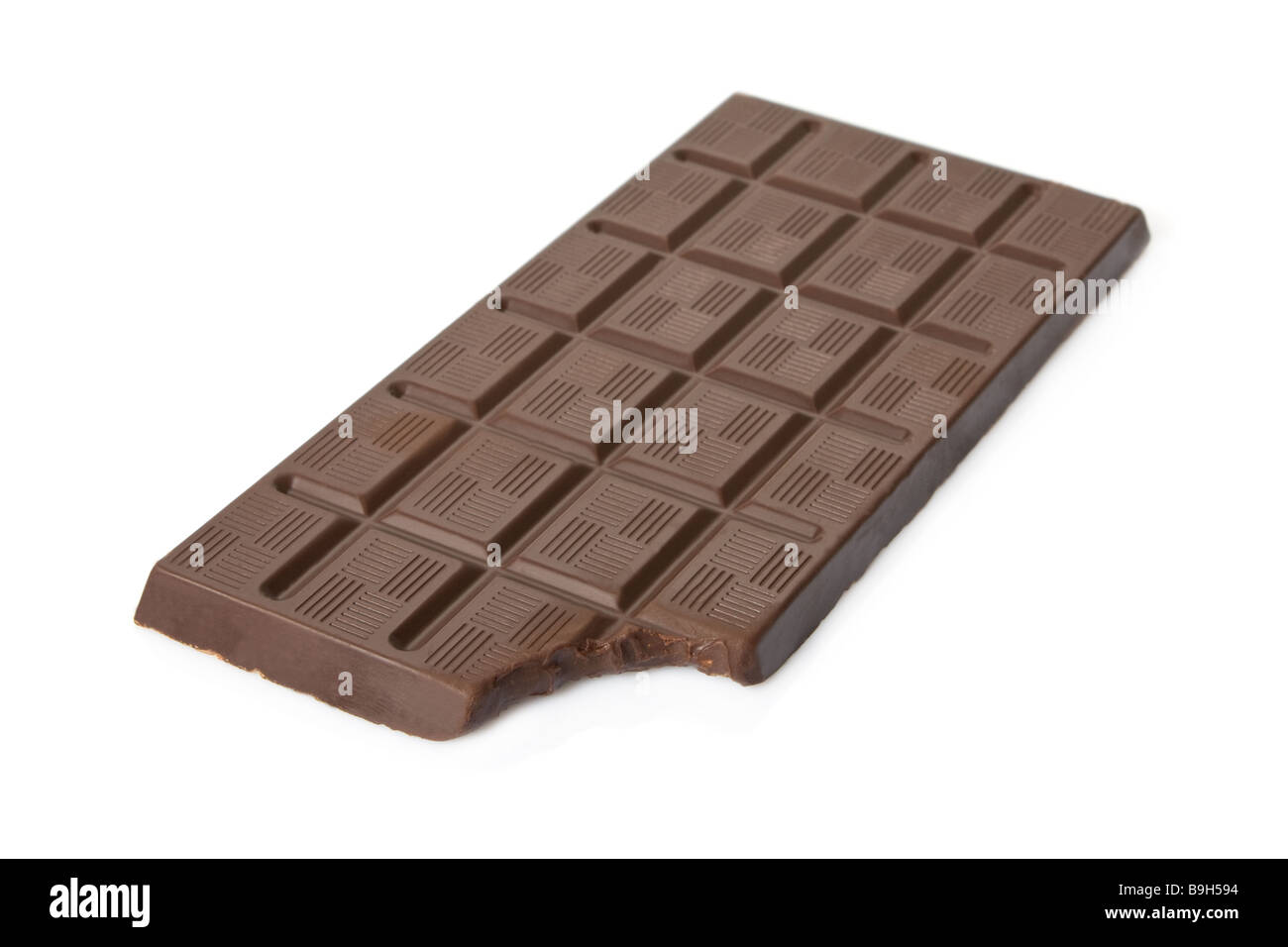 Bitten dark chocolate bar isolated on white background. eaten cut out milk cutout nibble sweet sweets brown candy dessert block food snack ingredient Stock Photo