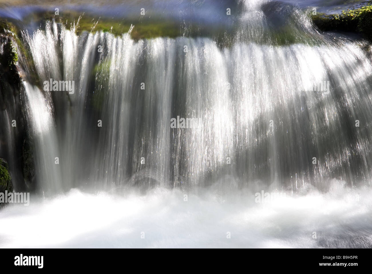 Brook chute meadow-brook river waters water flows waterfall symbol purity freshness clear clean naturalness element Brook Stock Photo