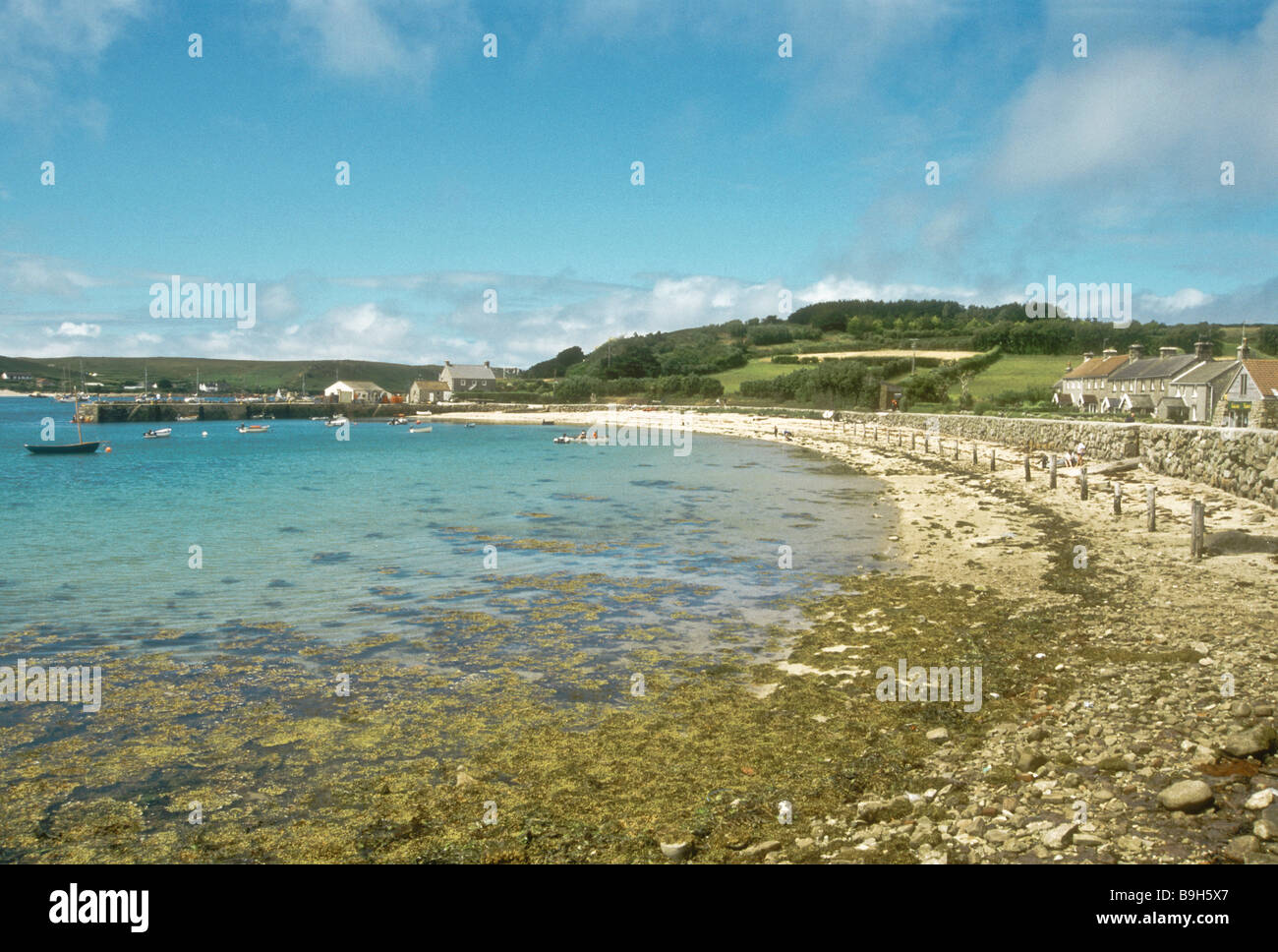 The beach and quay at New Grimsby on Tresco island Isles of Scilly England UK Stock Photo