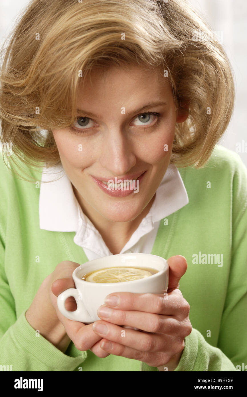 Woman teacup lemon slice holding drinks portrait broached Stock Photo
