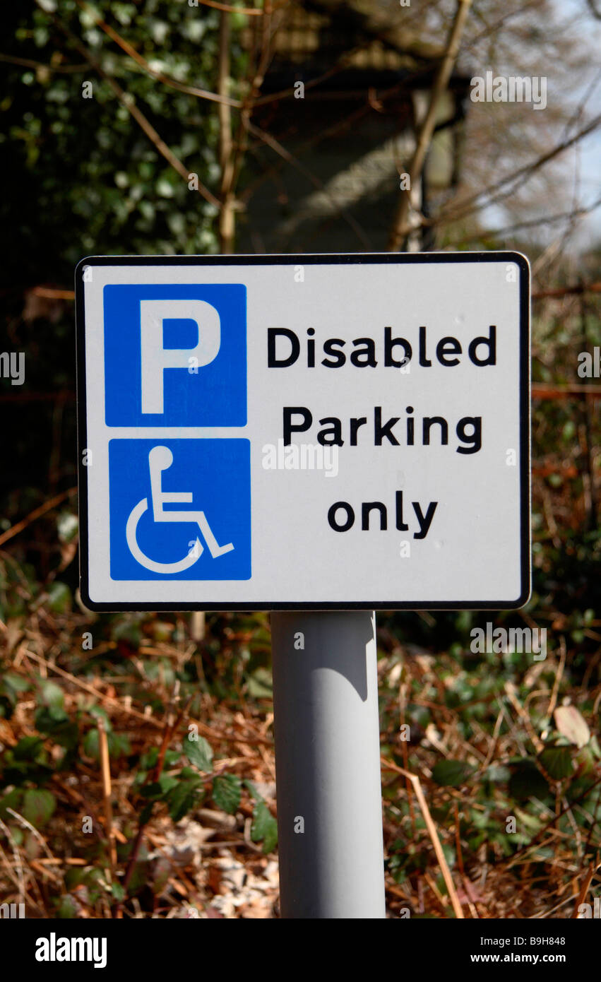 A sign above a special car parking space for disabled drivers in a