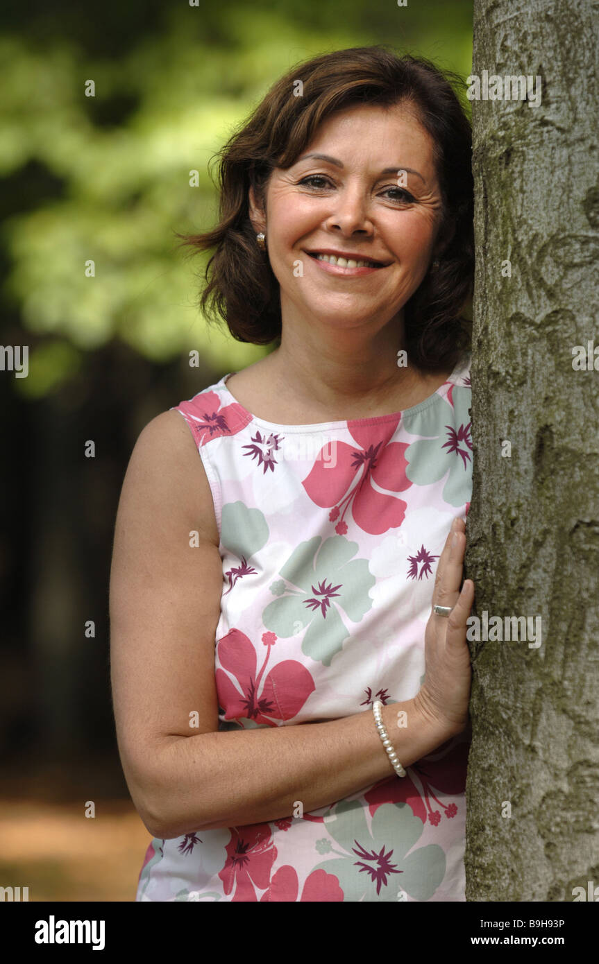 Park woman summer-dress smiling semi-portrait series people 50-60 years ...