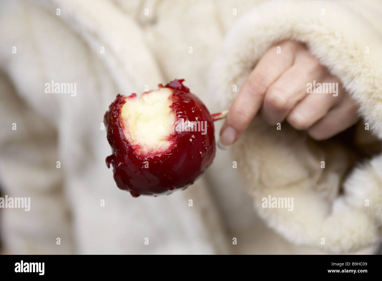 Holding woman detail hand candied apple wintry starves hotlyhunger red