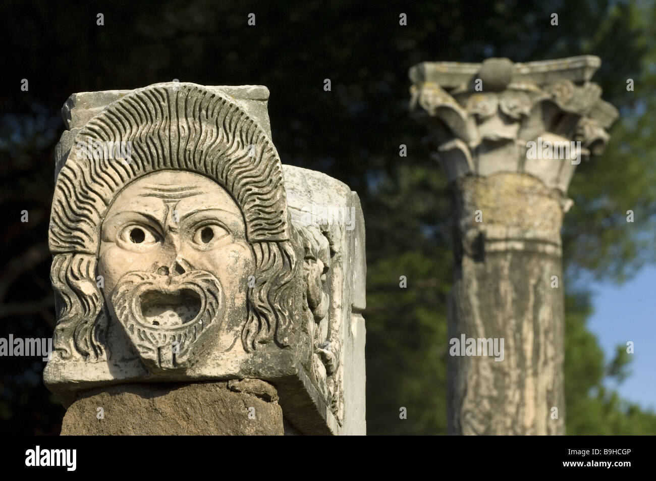 Italy Latium Ostia Antica ruins theaters detail face mask Antique Decumanus maximus detail former theater Europe history face Stock Photo