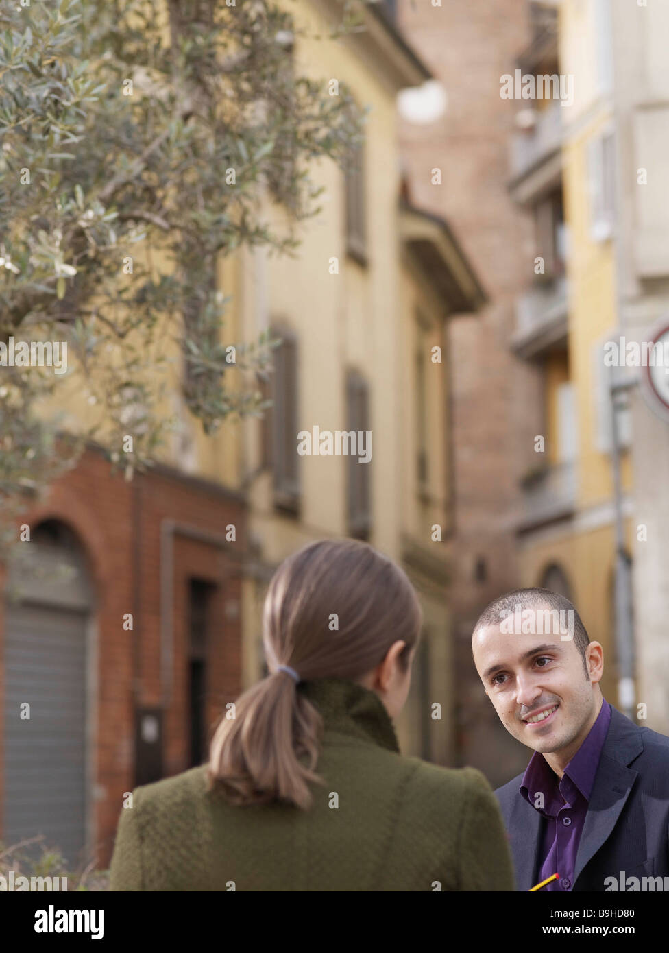 Man and woman in European street Stock Photo