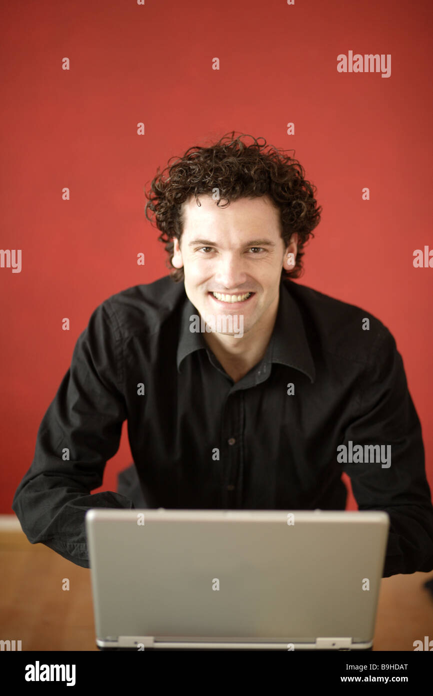 Man smiling Notebook data input portrait Stock Photo - Alamy