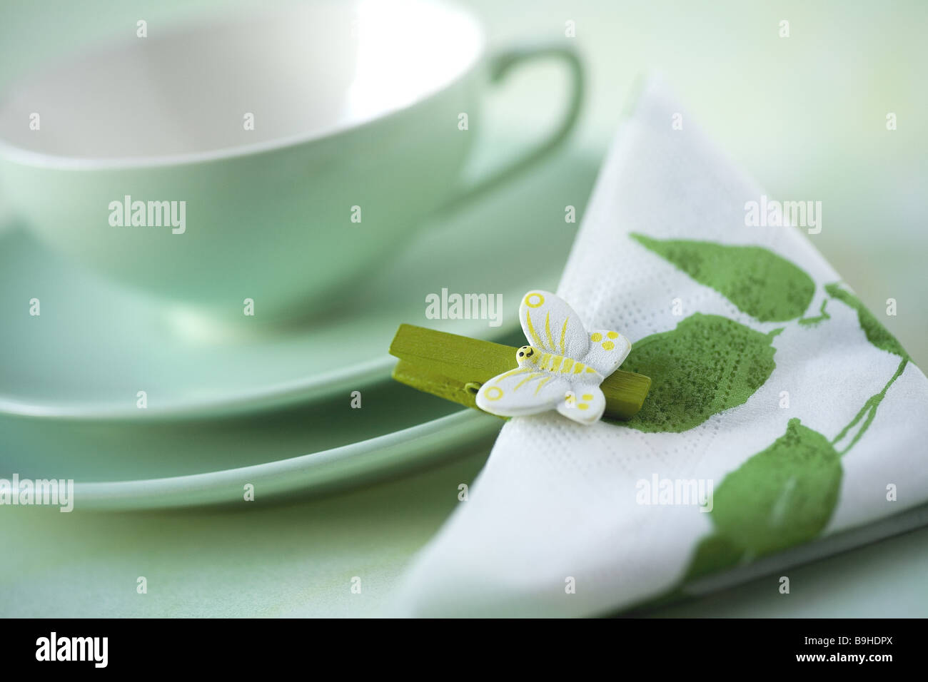 Teacup napkin clamp butterfly Stock Photo