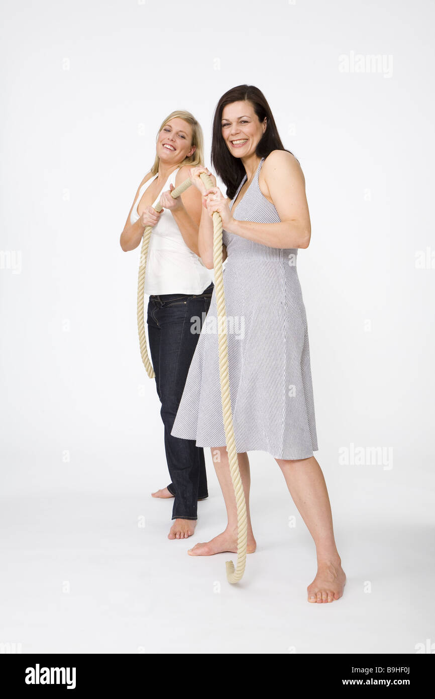 Women friends fun rope-moves series people two 30-40 years blond ...