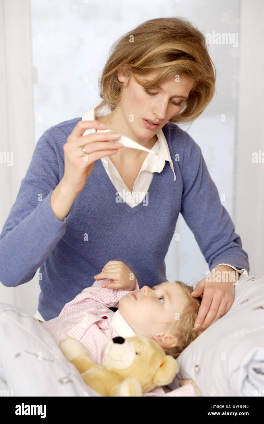 girl  sick  bed  lie  mother  fever-fairs Stock Photo