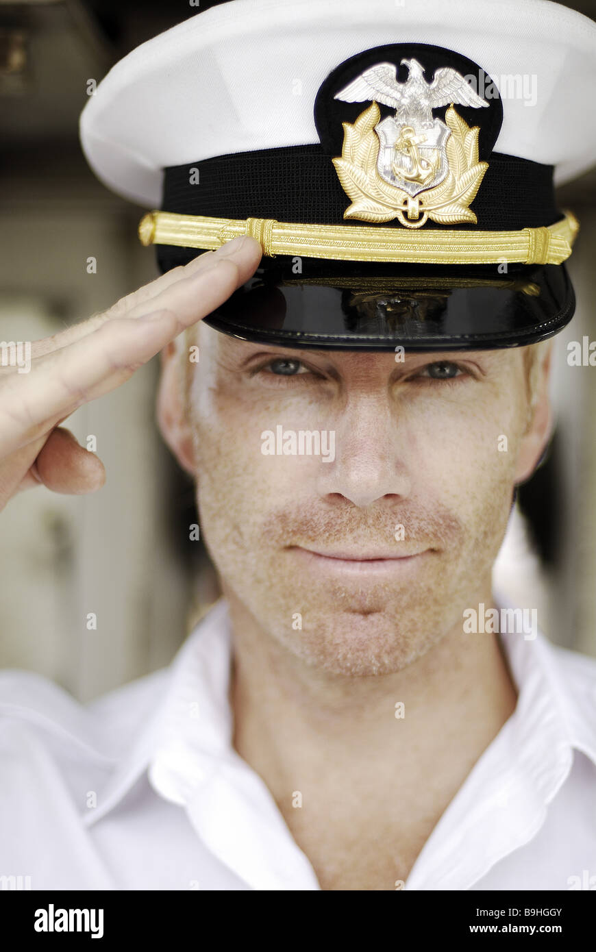 Ship's captain salutes smiling portrait 40-45 years 40-50 years ...