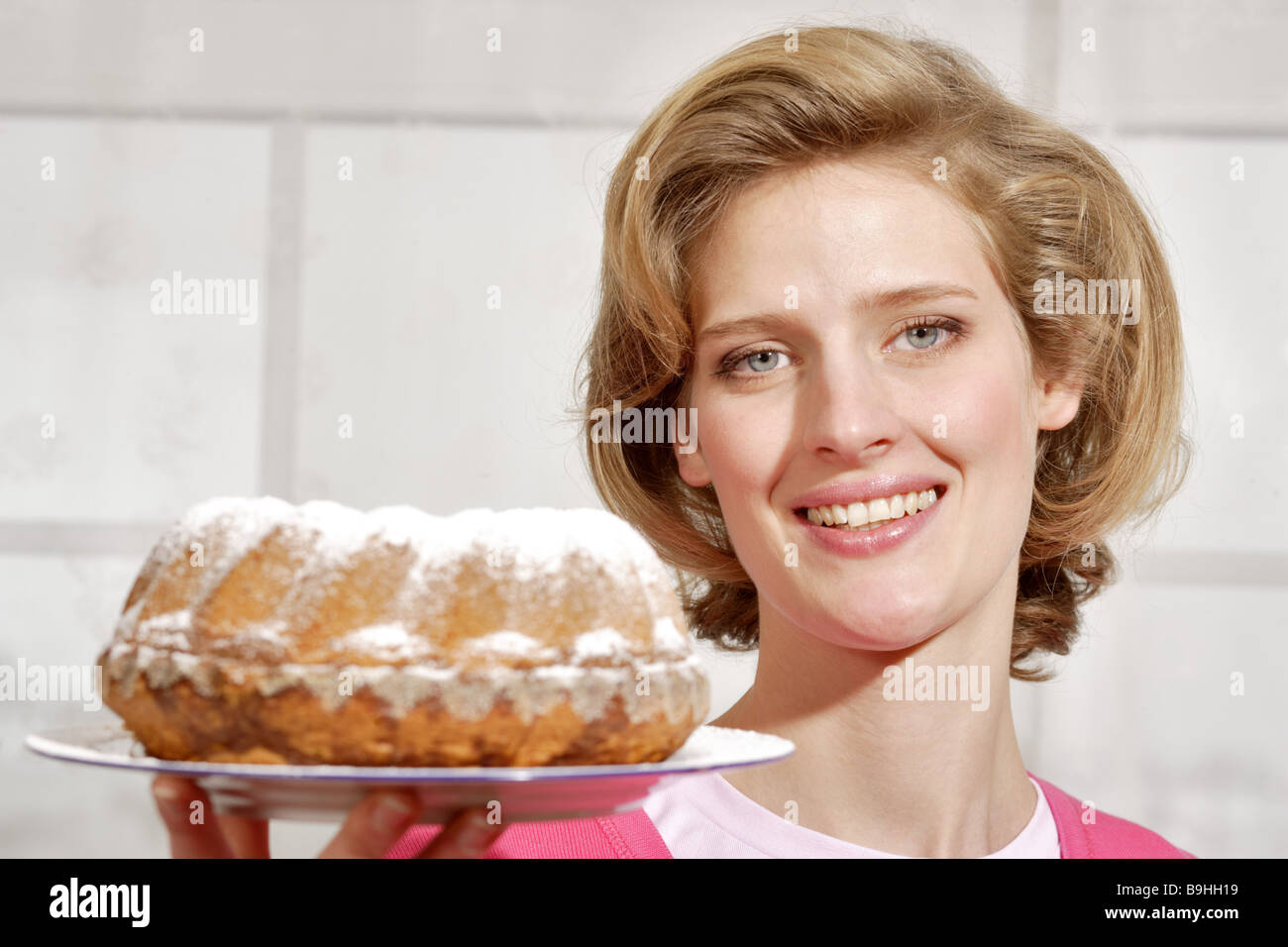 Woman young cakes smiling holding portrait Stock Photo - Alamy