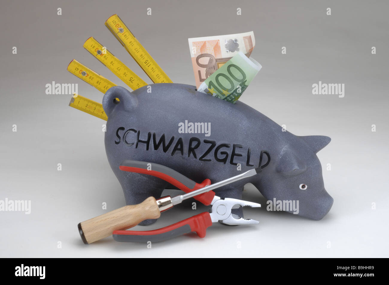 saving-pig bills Euro meter-rod tongs screw-turners screwdrivers craft-stuff tools craftspersons craft illicit work black cash Stock Photo