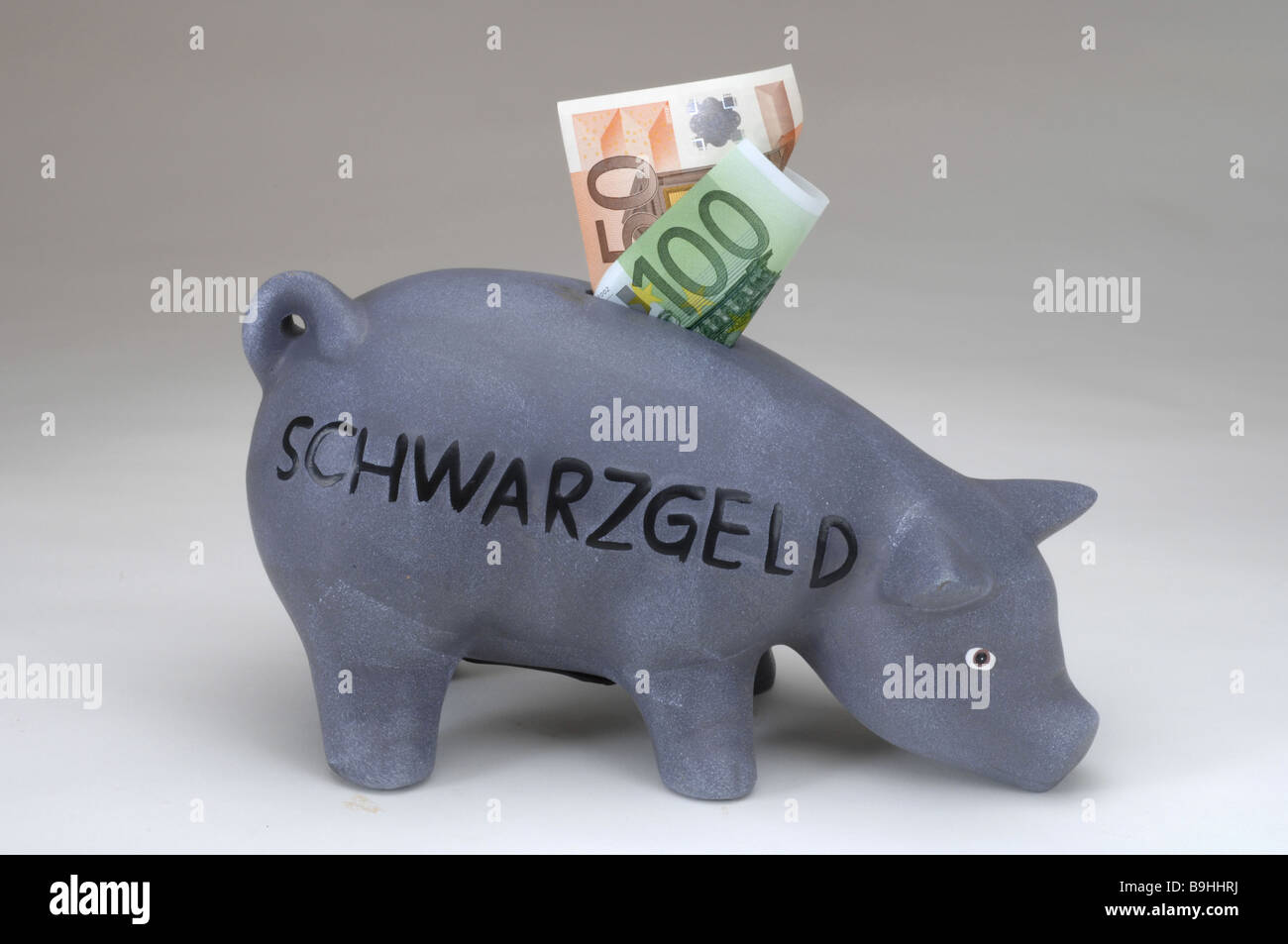 saving-pig bills Euro illicit work black cash register black-money cash register moonlighters saves tax evasion taxes Stock Photo