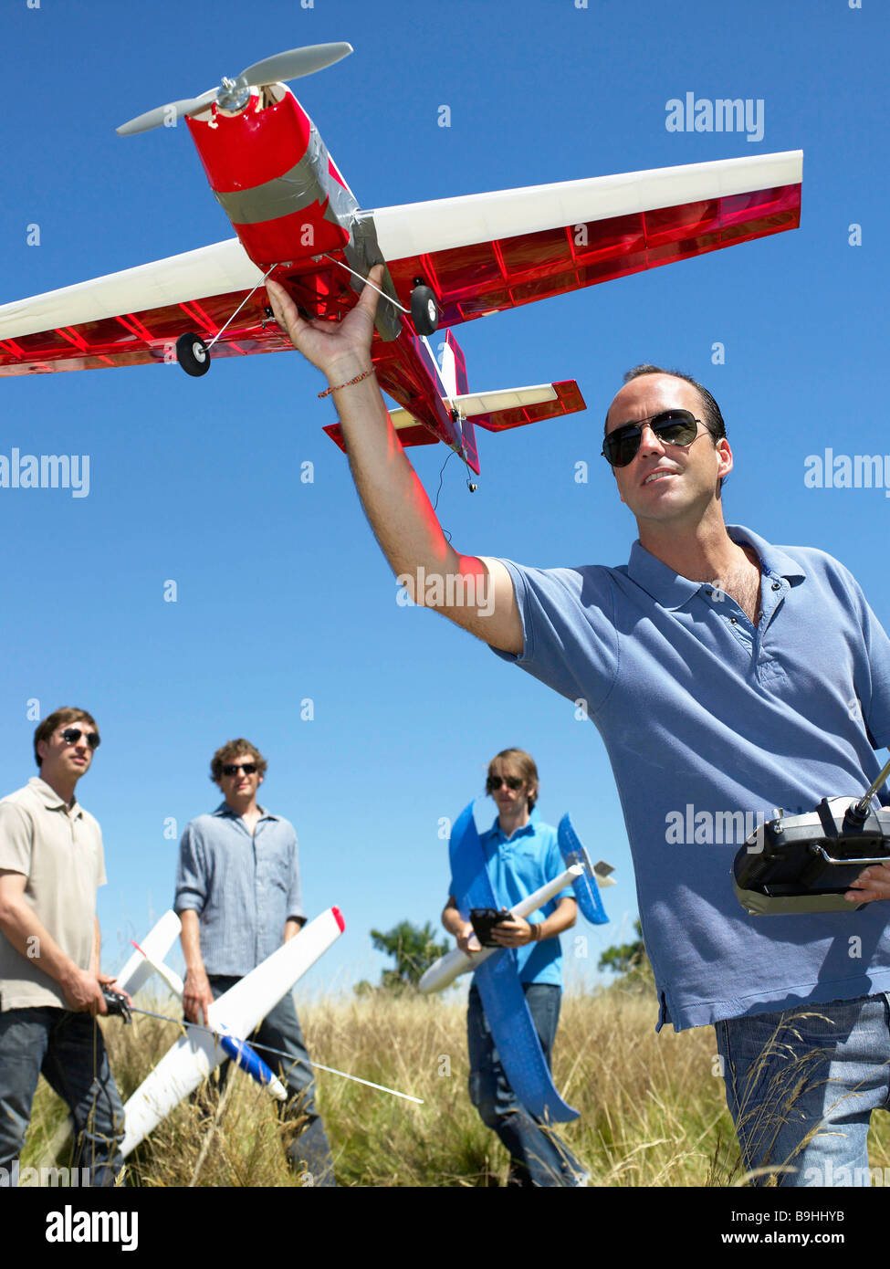 Men with remote-controlled plane Stock Photo