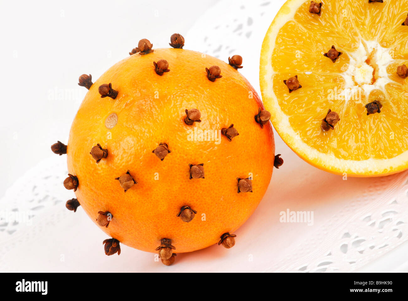 Oranges studded with cloves, aromatic christmas decoration Stock Photo