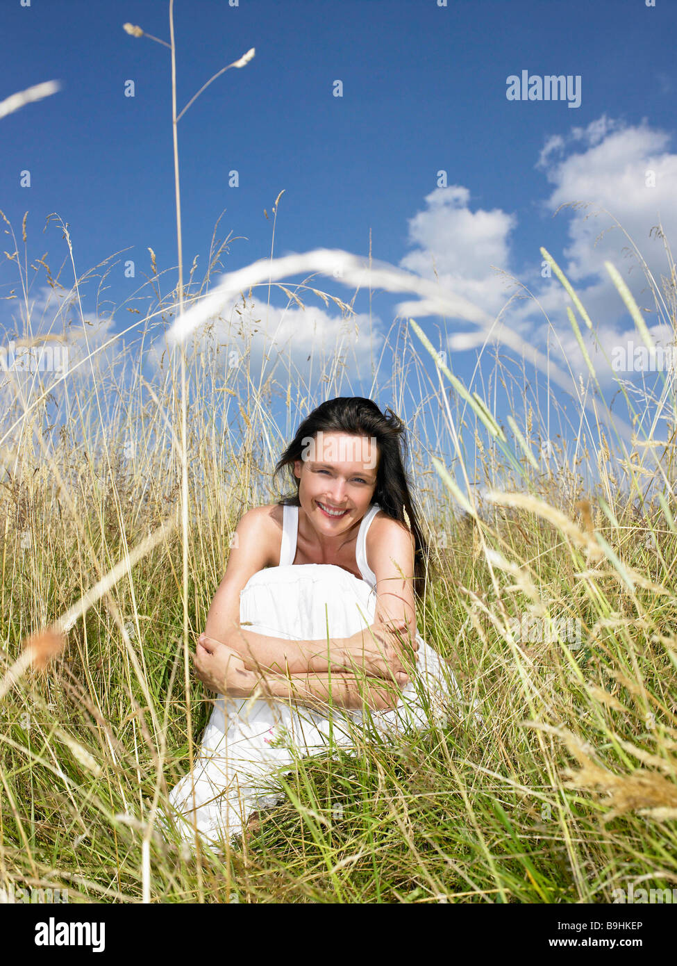 Seated woman hi-res stock photography and images - Alamy
