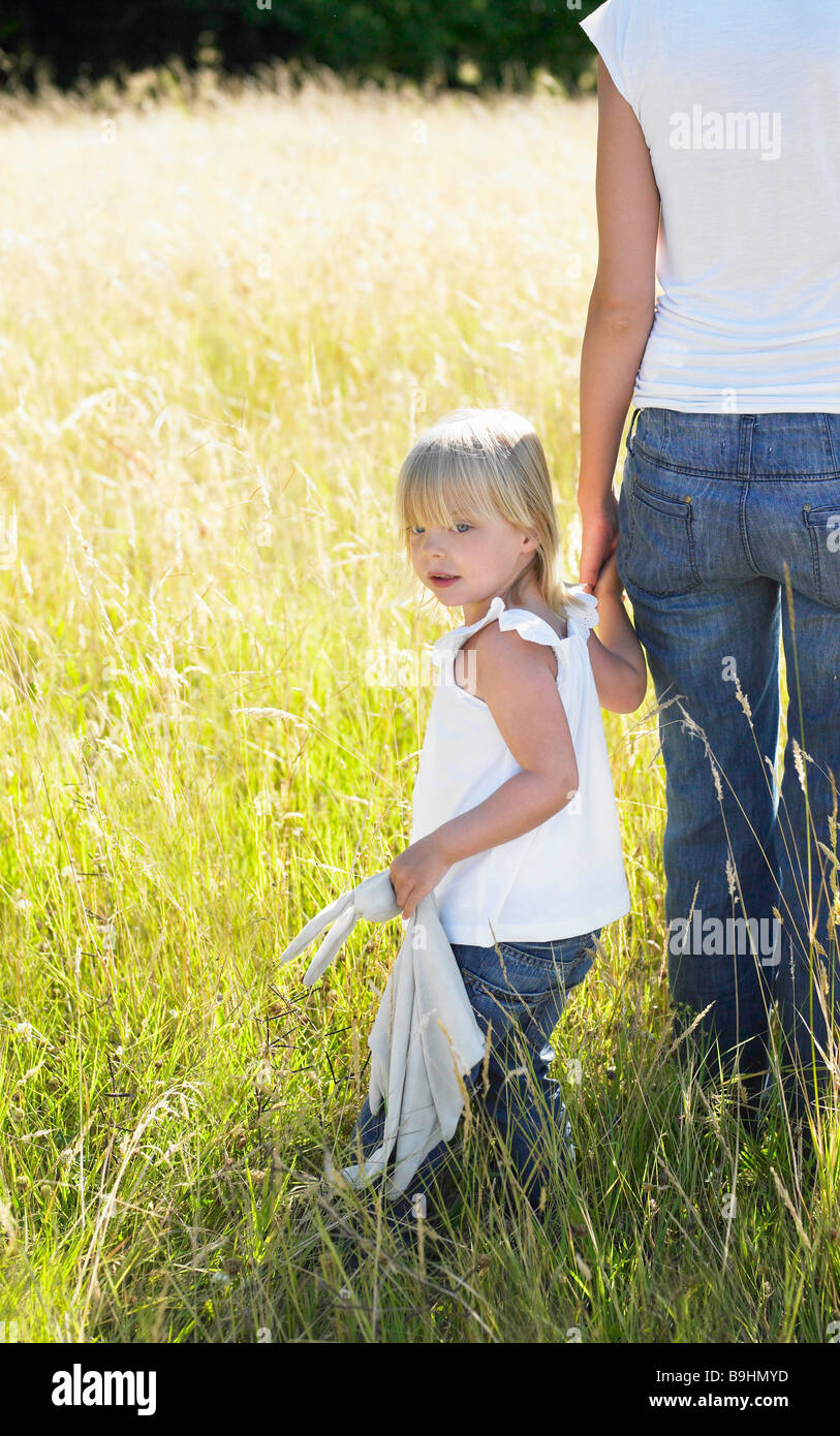 Mother and daughter in a field Stock Photo Alamy