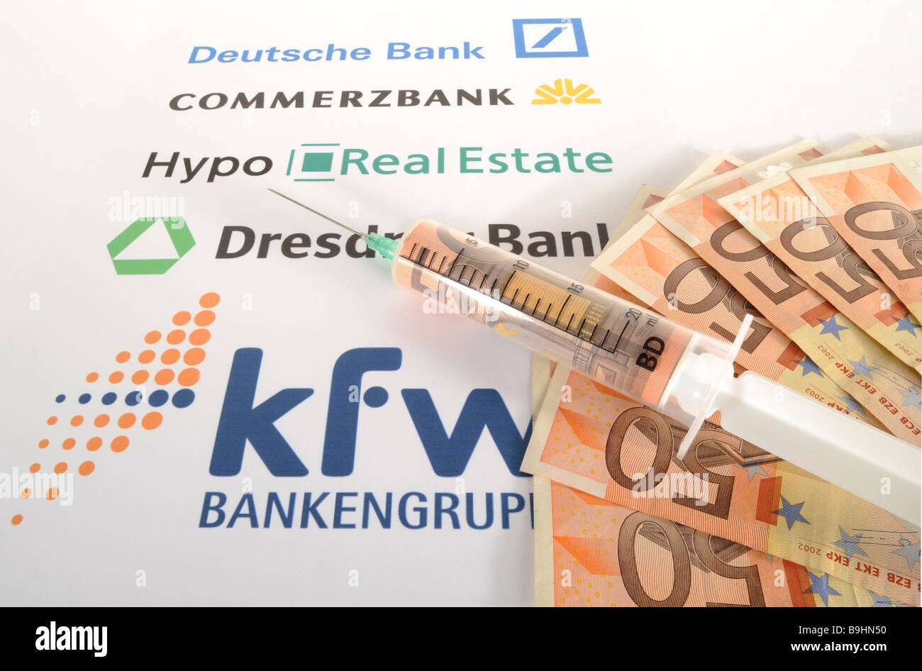 Injection needle on banknotes and bank logos, symbolic picture of cash injection for banks Stock Photo