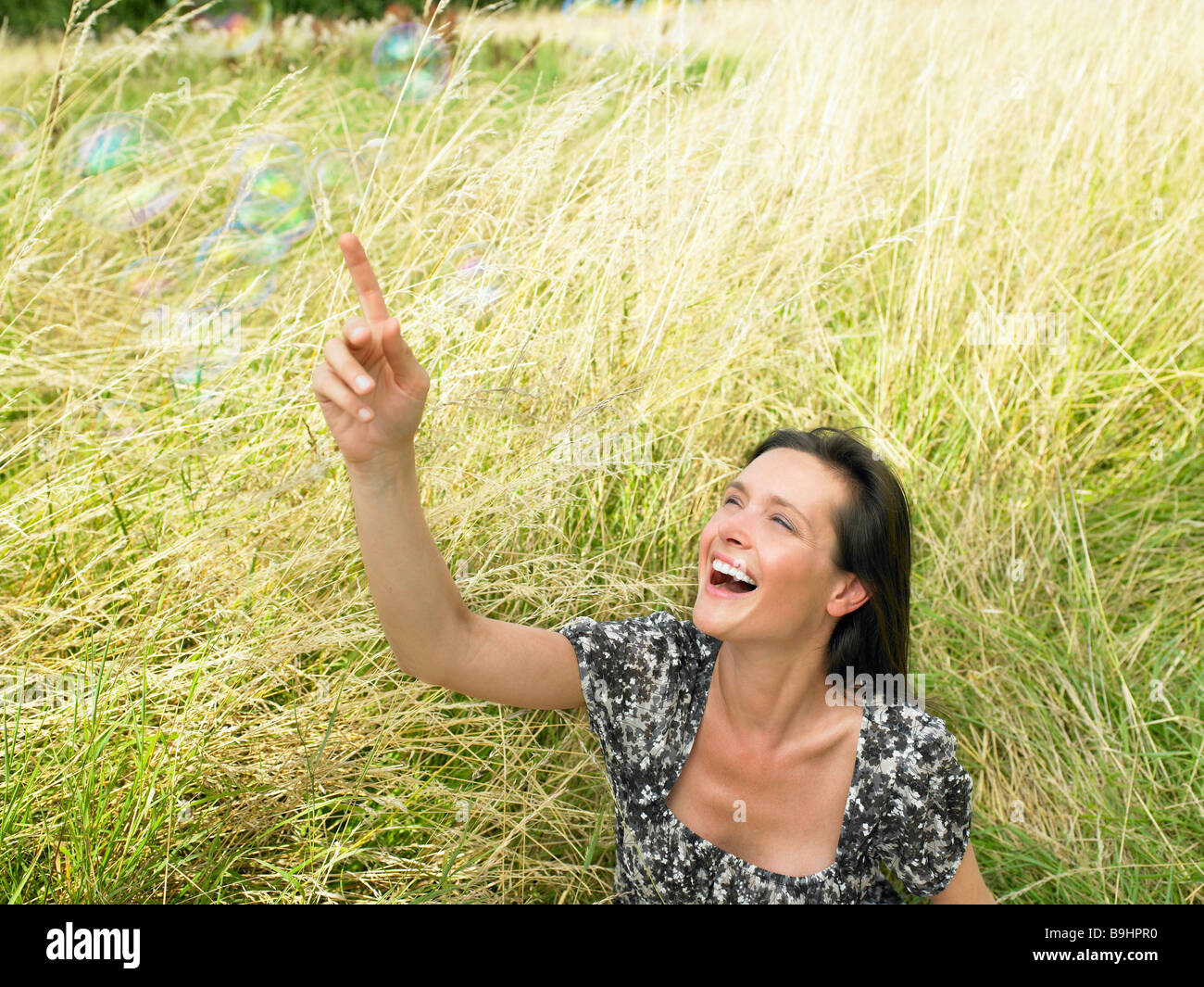 Reaching for soap bubbles hi-res stock photography and images - Alamy