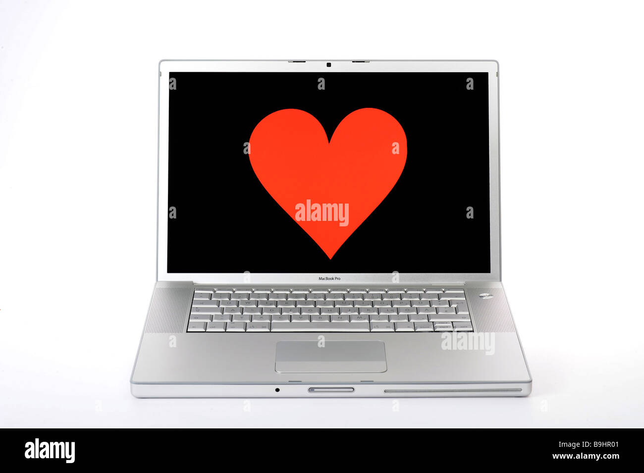 Heart on an Apple MacBook Pro screen, symbol for online dating Stock Photo