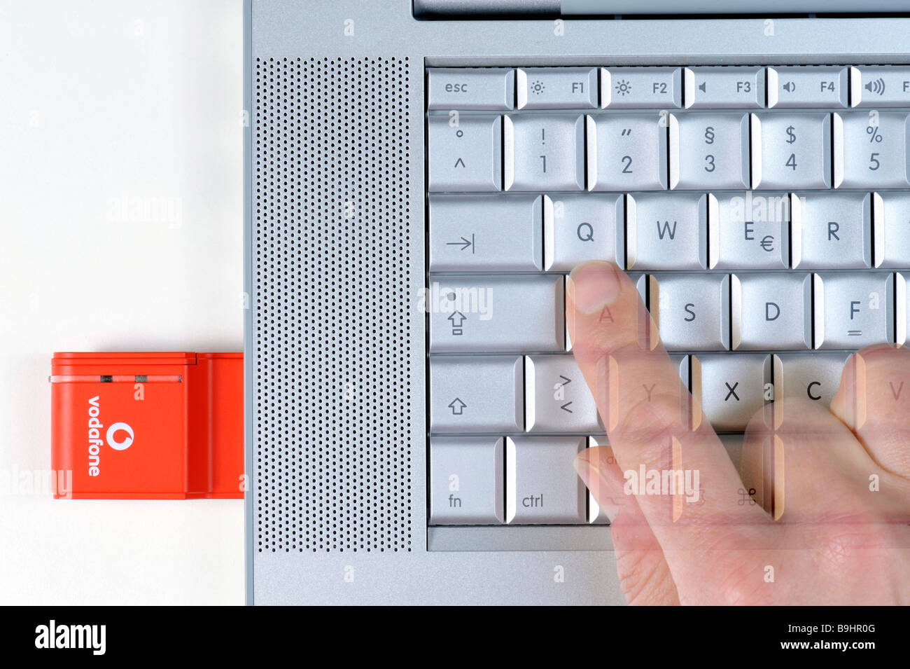 Apple Macbook Pro Keyboard Vodafone Umts Memory Card Finger Stock Photo Alamy