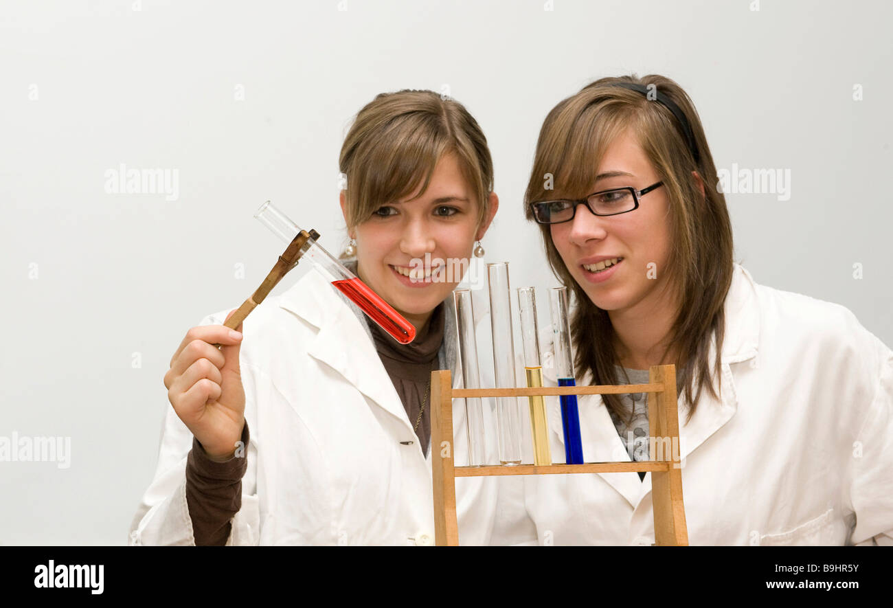 Youths working with test tubes during chemistry lessons Stock Photo