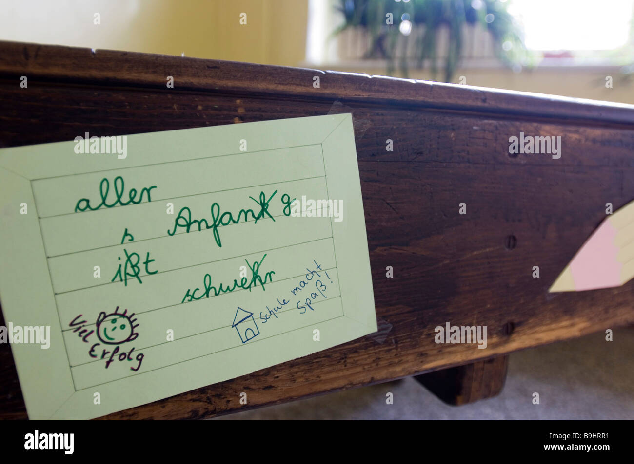 Old school desk with an index card and text with spelling mistakes Stock Photo