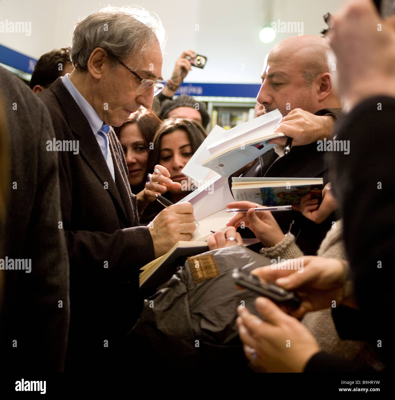 Songwriter Franco Battiato signing copies of his book at Flaccovio bookshop Palermo Italy Stock Photo