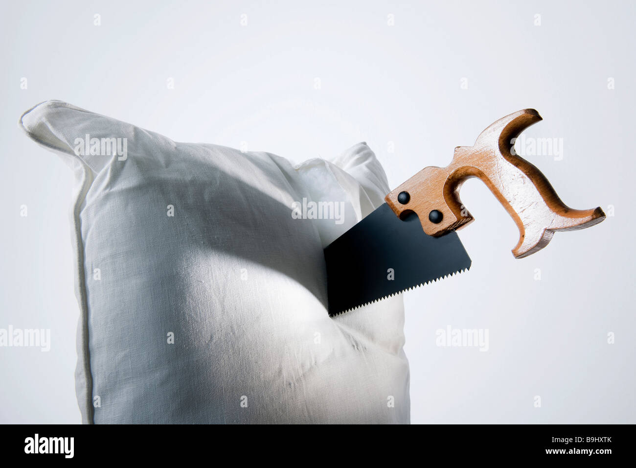 Saw, pillow, symbolic of snoring Stock Photo