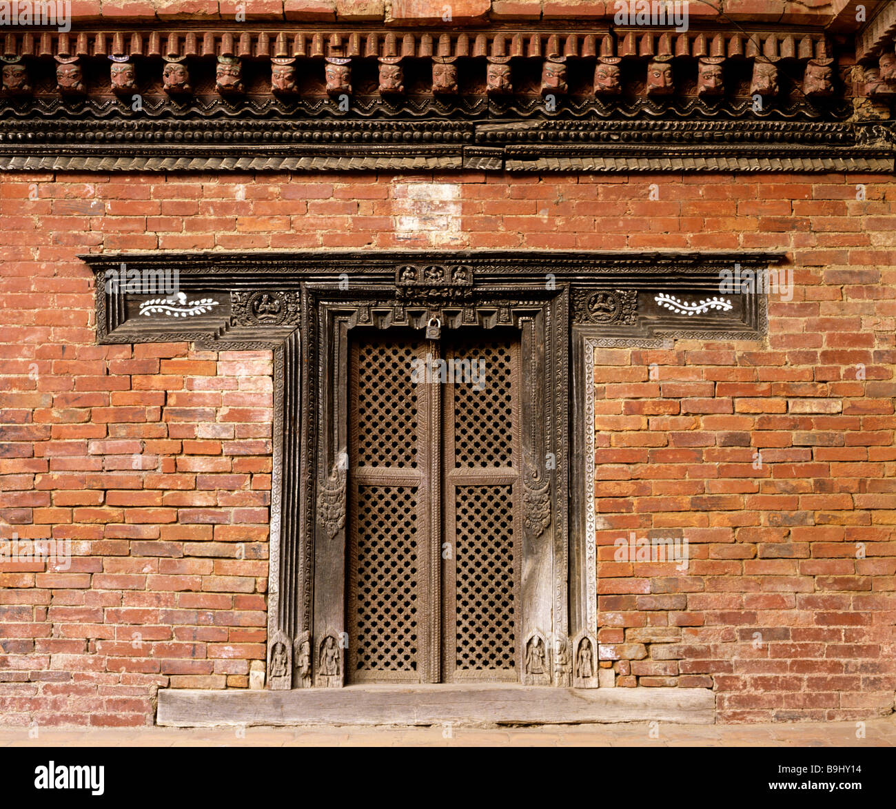 Decorated wooden door on the royal palace, Patan, Lalitpur, Nepal, South Asia Stock Photo