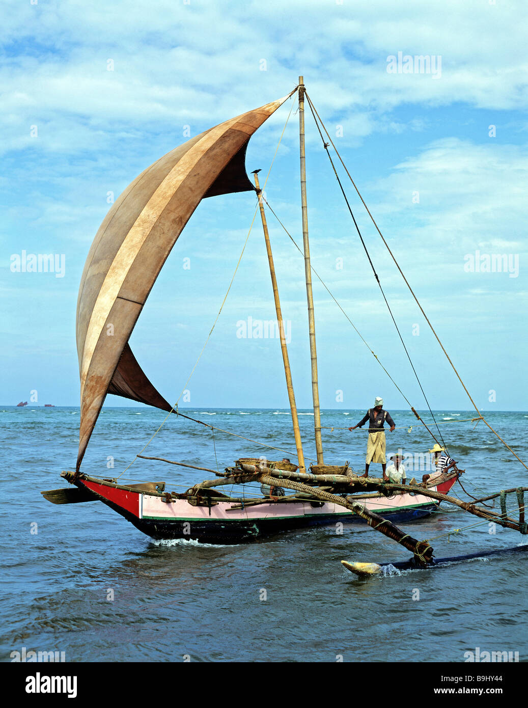 Fishing boat, sails, fishermen, Indian Ocean, Negombo, Sri Lanka Stock Photo