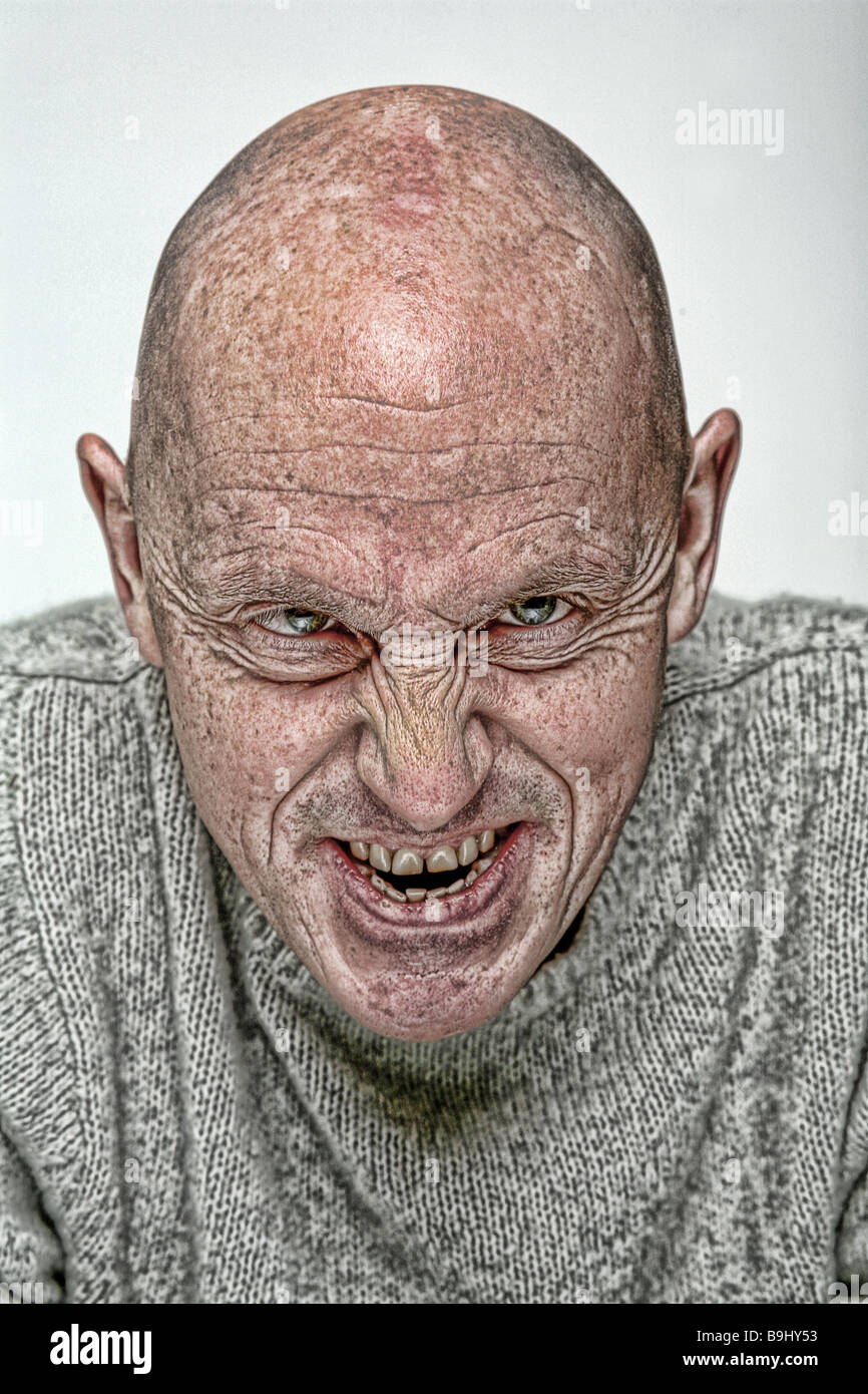 manipulated images of a middle aged bald man being angry aggresive, and scary Stock Photo