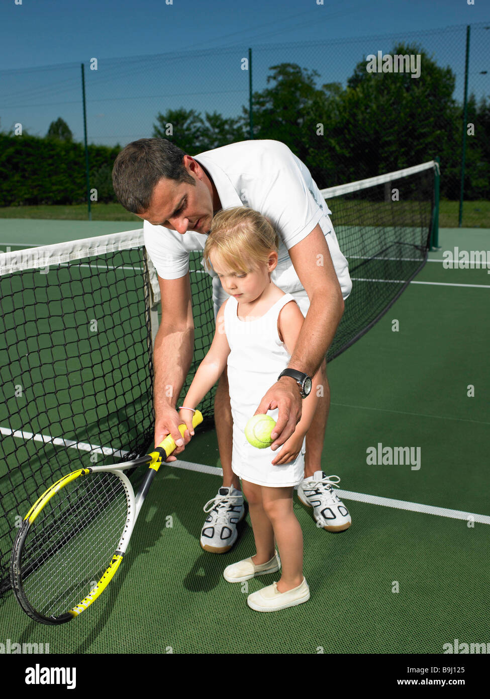 Tennis lesson for young child Stock Photo