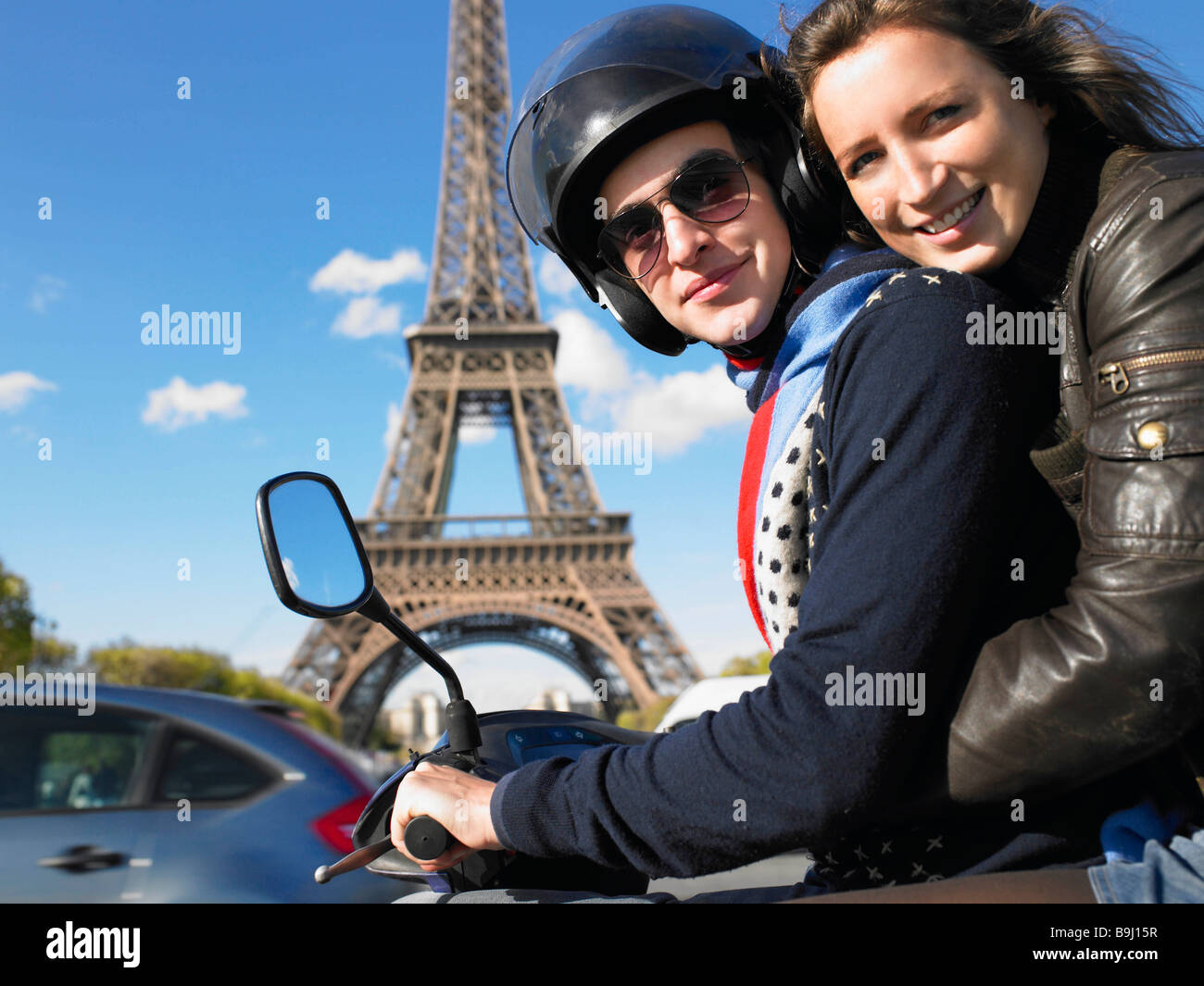 Couple on moped in Paris Stock Photo