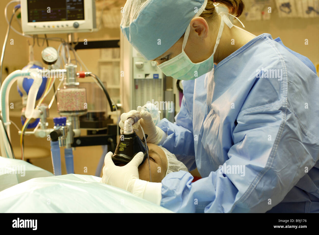 Anaesthetist and patient in the operating room Stock Photo