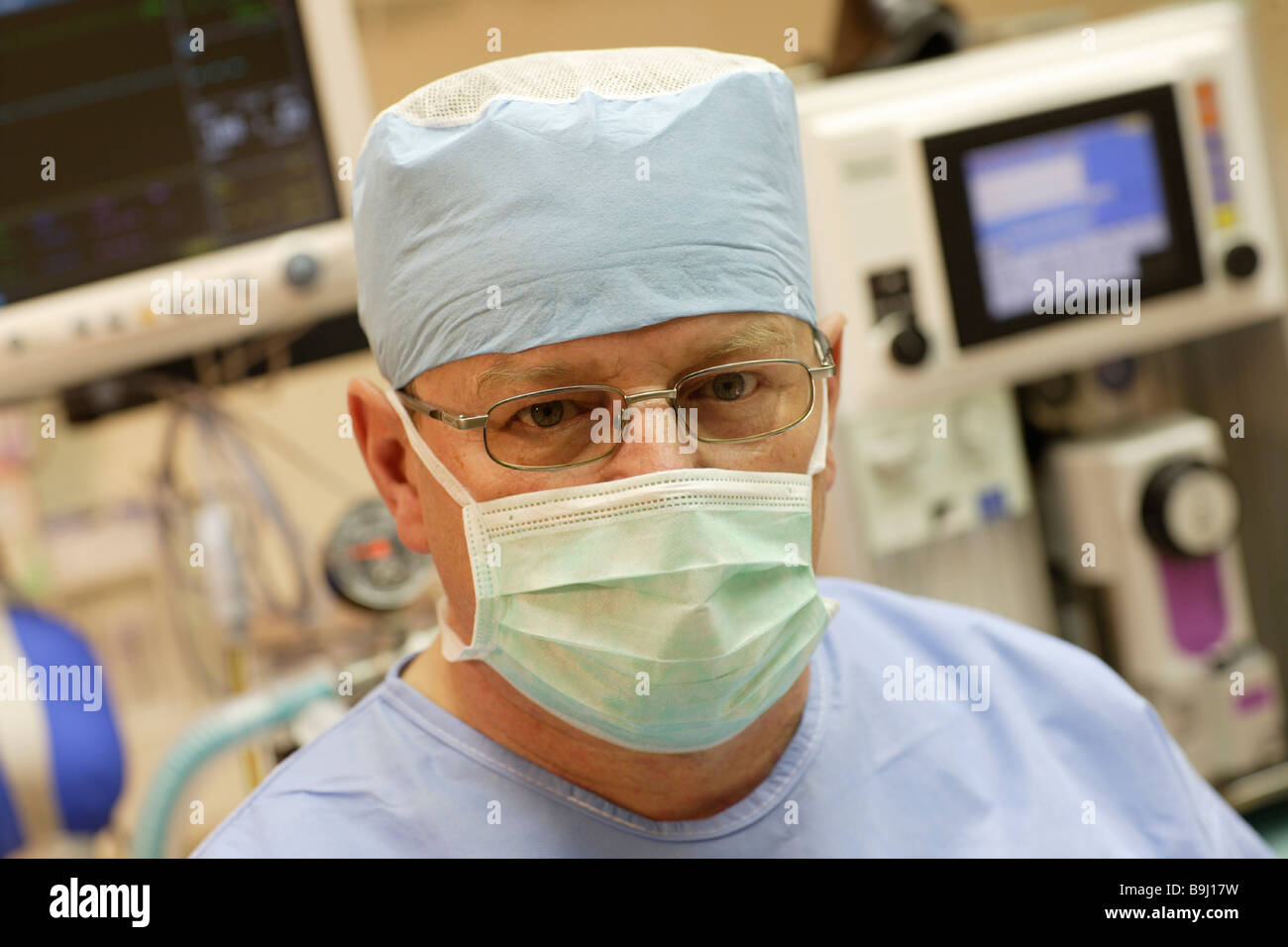Doctor wearing surgical mask in the operating room Stock Photo