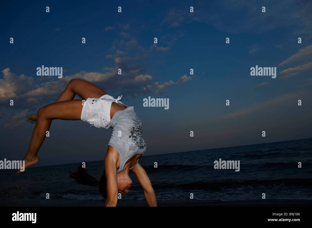 Teenager making gymnastics Stock Photo