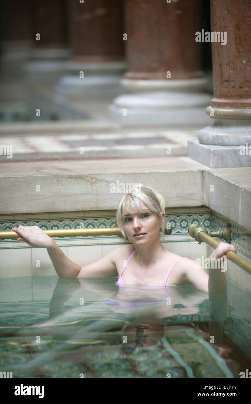 Woman in indoor pool Stock Photo