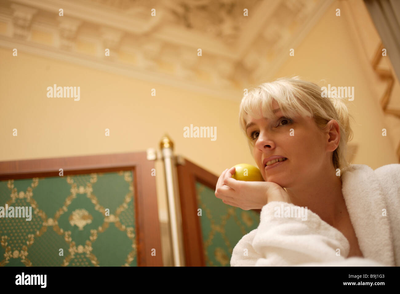 Young woman wearing bathrobe Stock Photo Alamy