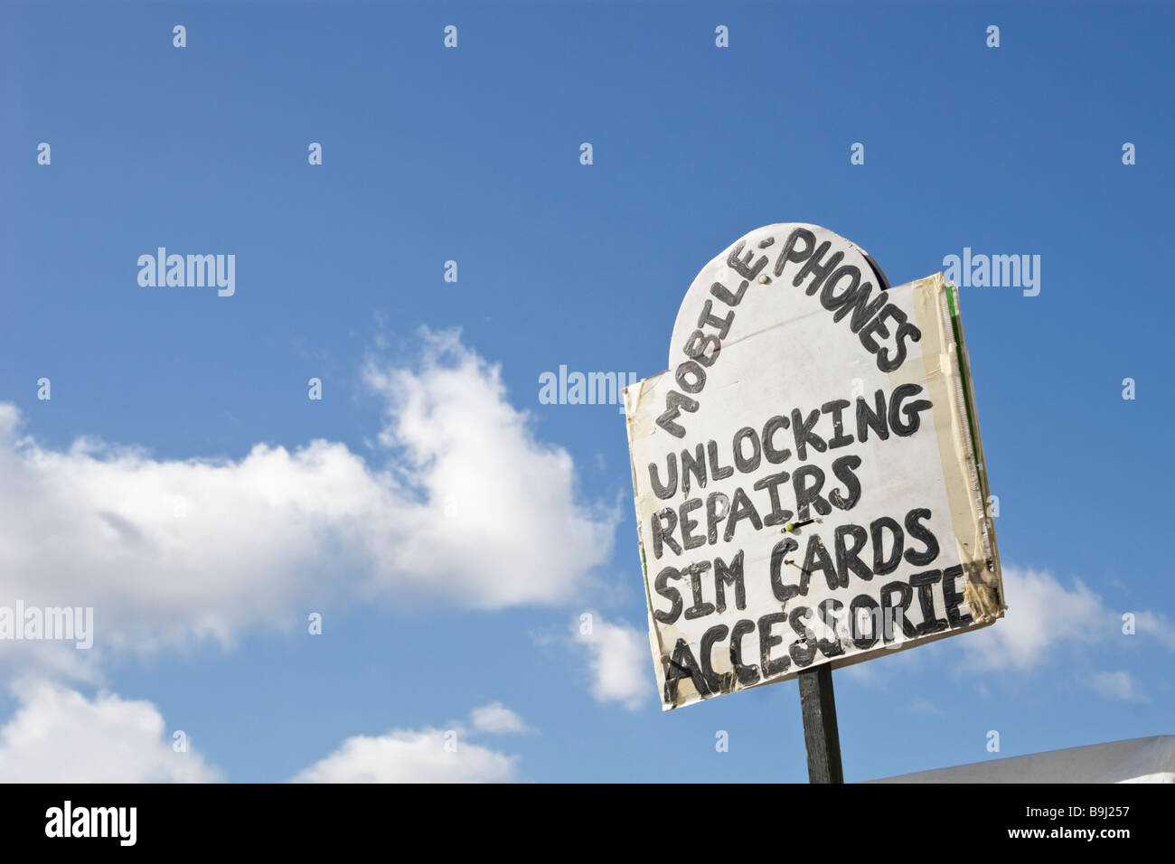 Mobile Phone unlocking service sign Stock Photo Alamy