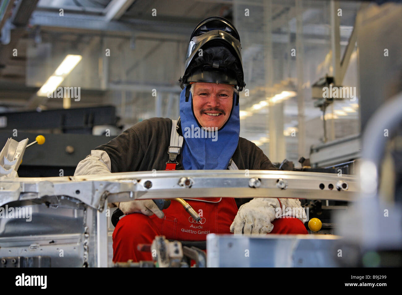 Welder wearing protective mask, Audi R8 construction at the Audi Plant in Neckarsulm, Baden-Wuerttemberg, Germany, Europe Stock Photo