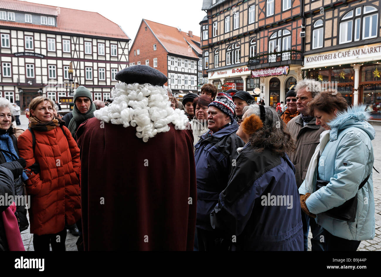 Guided tour at the market square in Wernigerode, tourists with the guide dressed in a historic costume and wig, Harz, Saxony-An Stock Photo