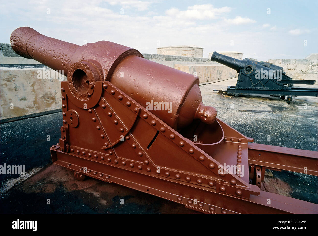 Historic canons, freshly painted with rust protection, red lead, iron oxide, Castillo de los Tres Santos Reyes Magnos des Morro Stock Photo