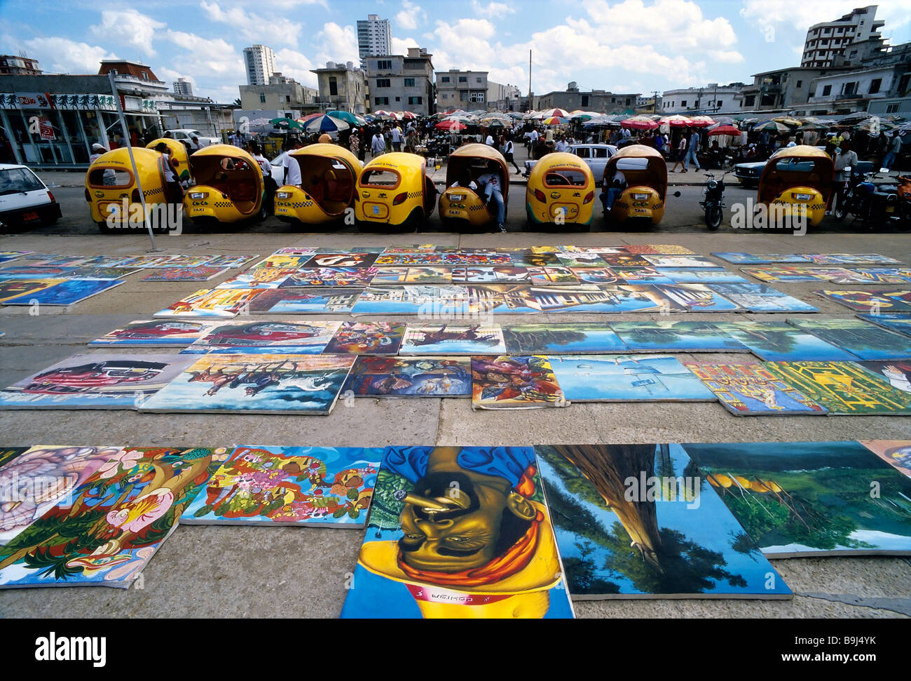 Flea market, Cuban paintings on the floor, spread out for sale, Vedado, Havana, Cuba, Caribbean Stock Photo