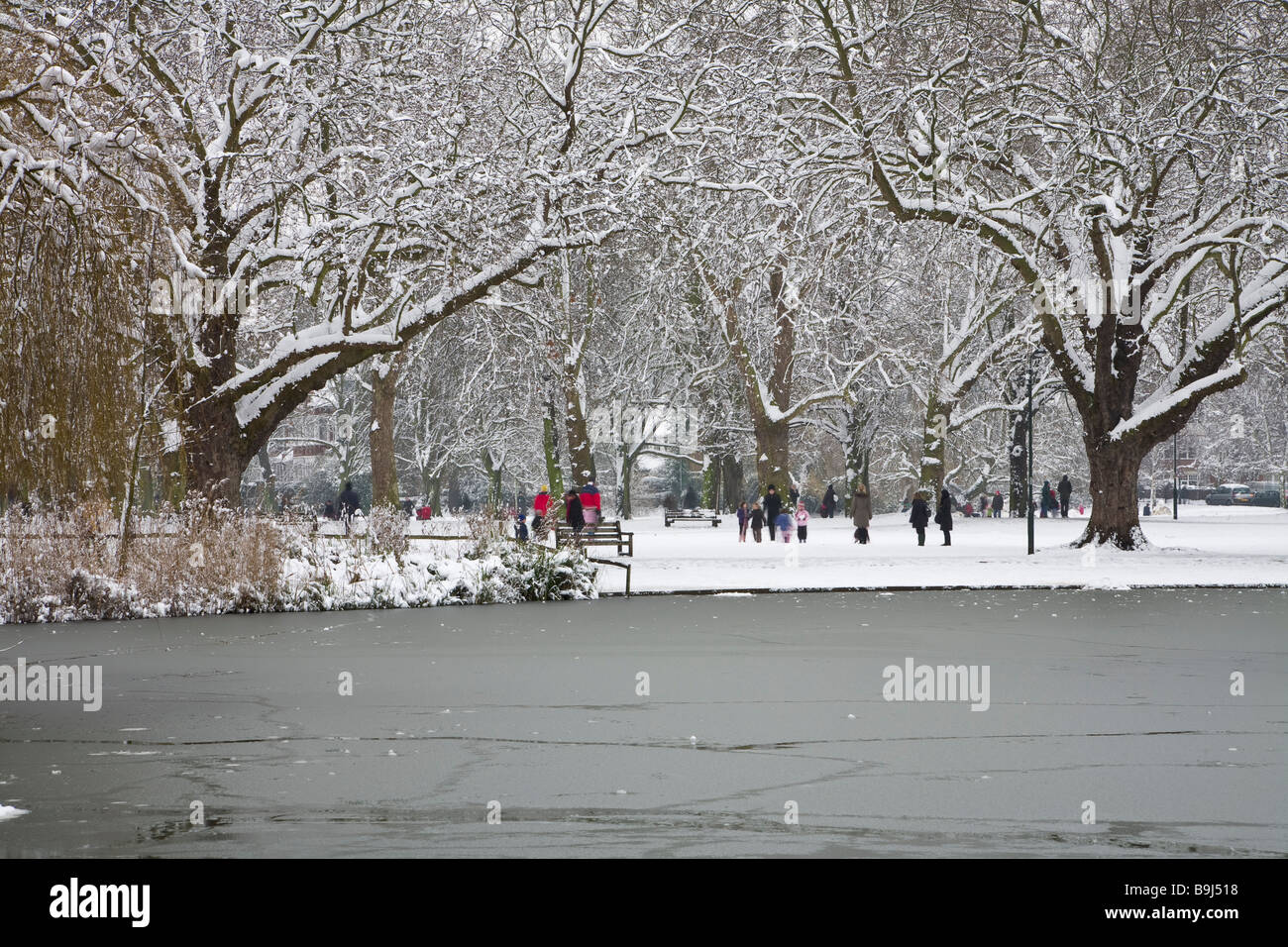 The frozen pond and snow-bound Green at Barnes, south west London, after a heavy snowfall in February 2009. Stock Photo