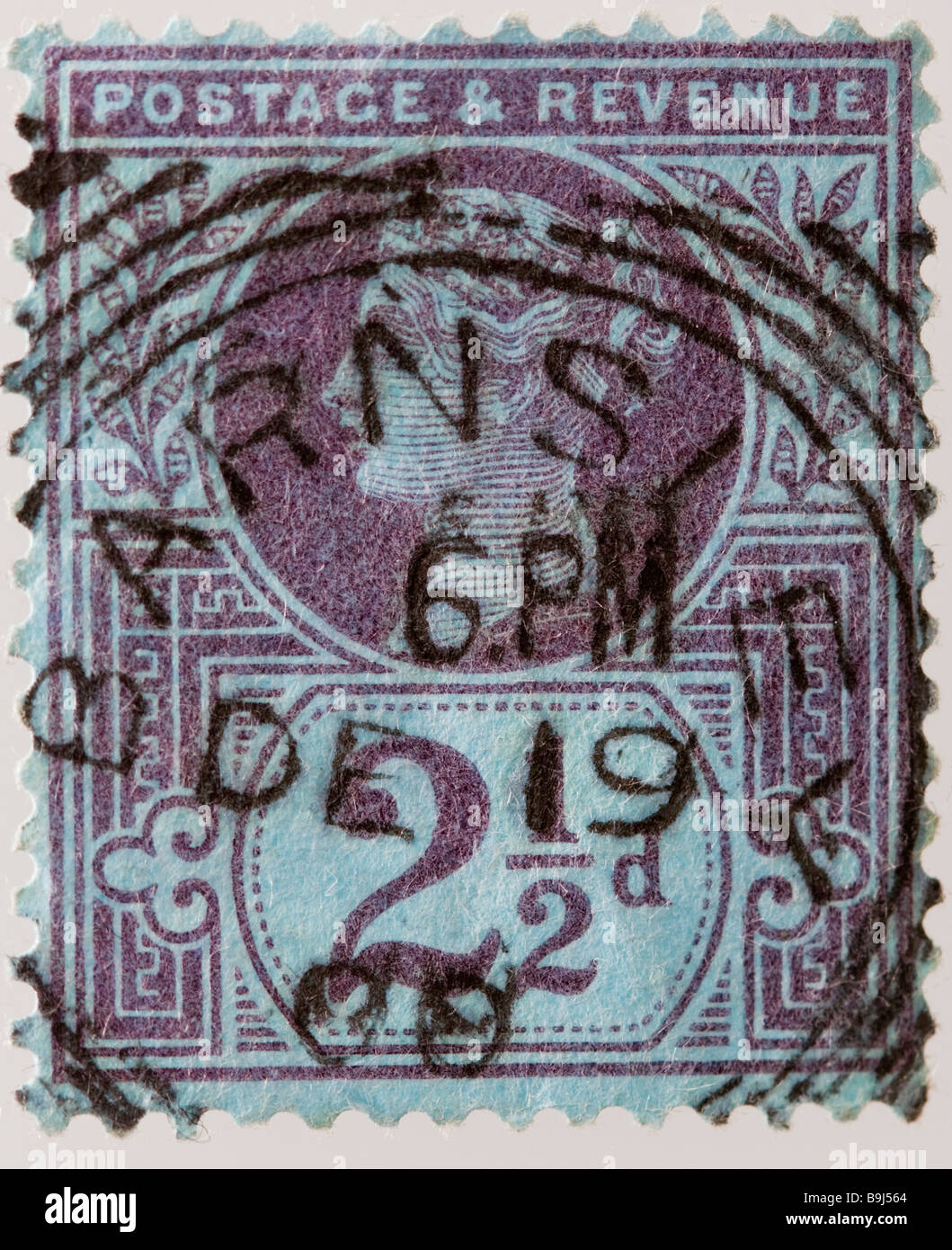 Close up of 2½d, purple Victorian British Postal stamp on white background issued between 1887